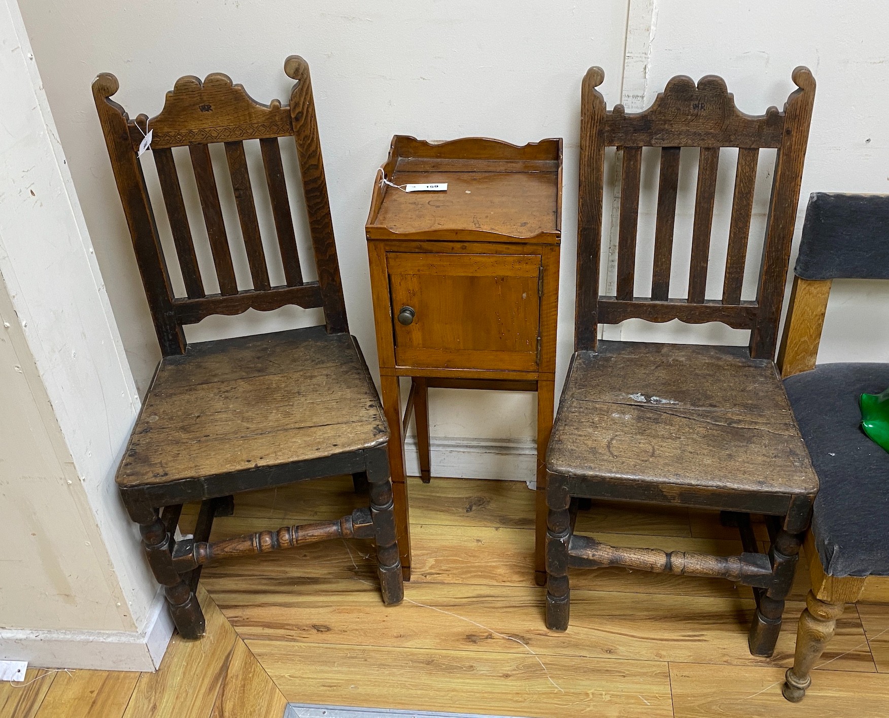A near pair of 18th century wood seat chairs, larger width 45cm, height 101cm